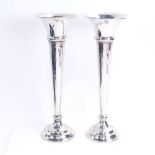 A pair of George V silver spill vases, tapered cylindrical form with fluted rims, by J & R