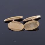 A pair of mid-20th century 9ct gold oval panel cufflinks, engine turned decoration, hallmarks