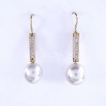 A pair of unmarked gold cultured pearl and diamond drop earrings, earring height excluding fitting