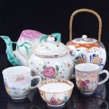 A group of Chinese porcelain teapots and cups, including a fruit design Cadogan teapot, height 12cm