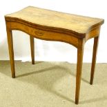 A Georgian satinwood and tulip wood crossbanded fold over card table, with serpentine front and