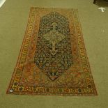 A Caucasian handmade geometric design rug, 274cm x 133cm.
