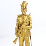 A 19th century gilt-bronze figure of a Prussian soldier, height 19cm