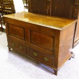 An 18th century panelled oak mule chest, with 2 drawers under, width 115cm