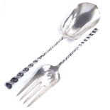 A pair of American sterling silver salad servers with industrial style twisted stems, by Whiting