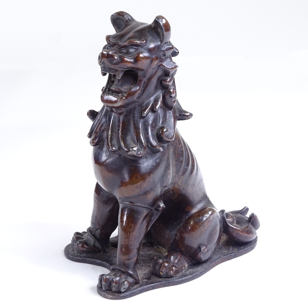 A 19th century Chinese patinated bronze Dog of Fo, height 13.5cm Good condition.