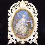 A 19th century watercolour on ivory, depicting a woman reading, indistinctly signed, mounted in