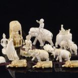 A collection of Indian 19th century ivory carvings, including a sedan chair