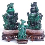 A pair of Chinese relief carved malachite pots and covers on rose quartz and hardwood stands, height