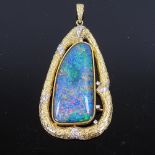 A large modern 18ct gold black opal doublet and diamond modernist abstract pendant, textured