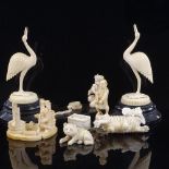 A group of Indian and Chinese ivory carvings, including a snake charmer