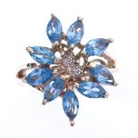 A modern 10ct gold blue topaz and diamond cluster flowerhead ring, setting height 21.9mm, size M,