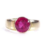 A large 18ct gold "ruby" solitaire ring, ruby measures: diameter - 8.16mm, depth - 5.28mm, size