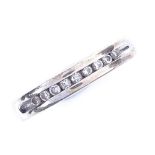 A modern 9ct white gold diamond half eternity ring, total diamond content approx 0.1ct, setting