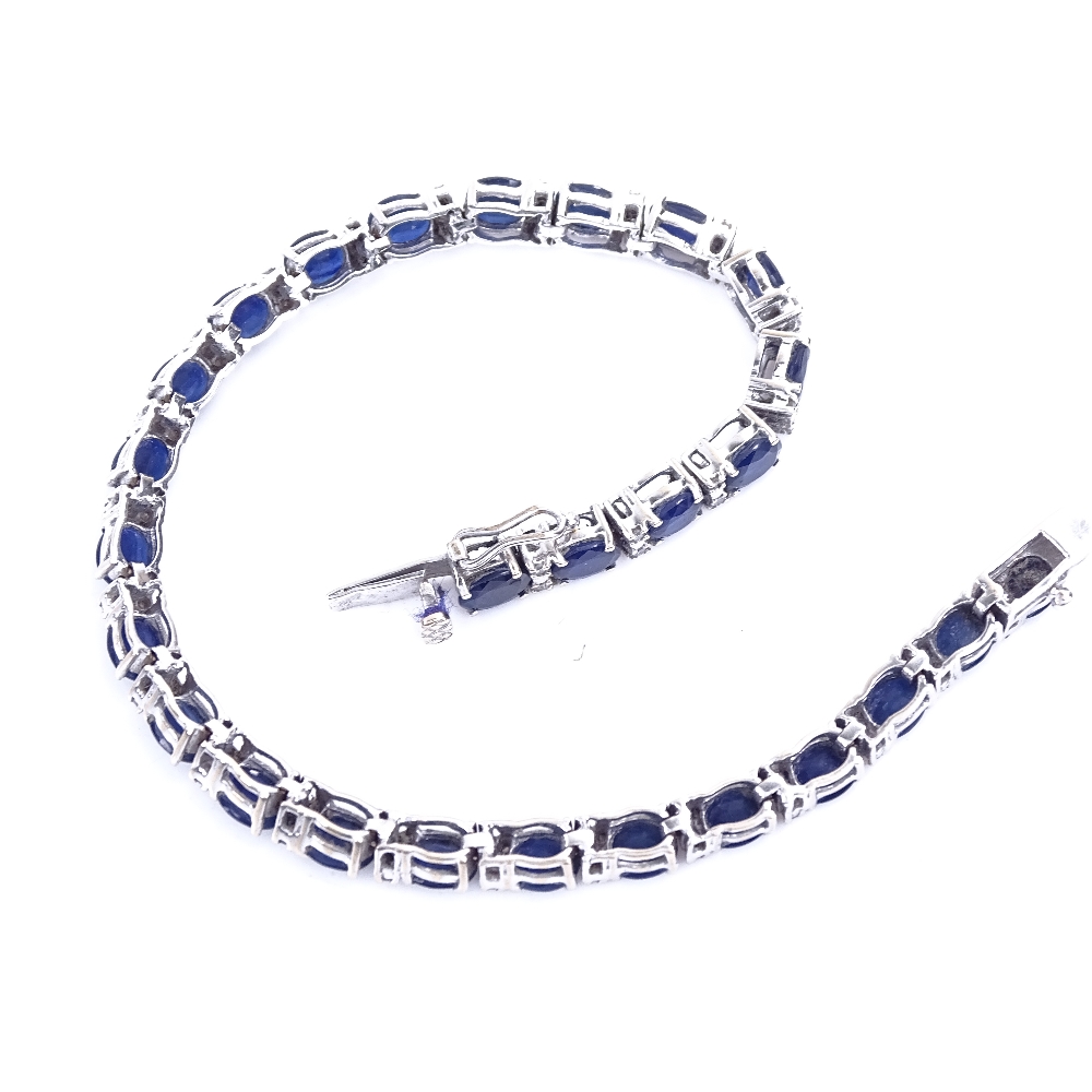 A modern 18ct white gold sapphire and diamond tennis line bracelet, total diamond content approx 0. - Image 3 of 5