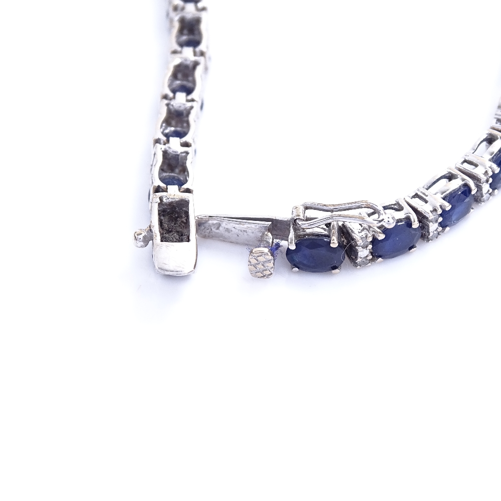 A modern 18ct white gold sapphire and diamond tennis line bracelet, total diamond content approx 0. - Image 4 of 5