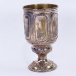 A Victorian silver footed goblet, cylindrical form with beaded panels and bright-cut engraved