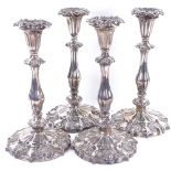 A set of 4 Victorian silver table candlesticks, shaped form with acanthus leaf decoration and