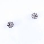 A modern pair of 9ct white gold diamond cluster stud earrings with 18ct gold topped settings,