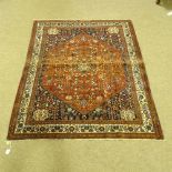 A handmade Abadeh floral decorated rug, 207cm x 158cm.