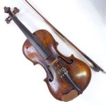 An 18th century violin, indistinct label with date 1703/09?, back length 35cm, with bow and case