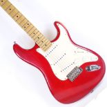 A Fender Stratocaster red electric guitar, serial no. Z4039095, circa 2000, with Fender case Back