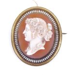 A fine 19th century relief carved hardstone panel cameo brooch, depicting female profile, in