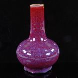 A Chinese Jun Ware narrow-neck porcelain vase with red glaze, 4 character mark, height 18cm Repaired