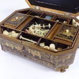 A 19th century chinoiserie gilded and lacquered sewing box, on carved giltwood feet, interior fitted