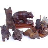 A group of 19th century Black Forest carved wood bears, including an artist bear painting a picture,