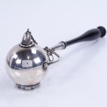 An American sterling silver and turned ebonised wood Go To Bed, on gimballed handle with attached