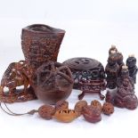 A group of Oriental miniature carved wood figures, carved nut boats, horn buffalo etc