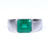 A Colombian emerald ring, rectangular emerald-cut emerald weighing approx 2.42ct bezel-set in