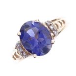 A modern 9ct gold iolite and diamond dress ring, with pierced heart shape shoulders, iolite length