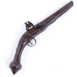 An 18th century Continental flintlock pistol with brass mounts, overall length 46cm Lock and trigger