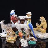 A group of mainly 19th century porcelain animals, including Mr Punch match striker, length 8cm