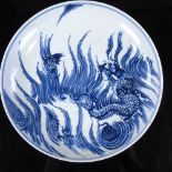 A Chinese blue and white porcelain dish, with painted dragon design, 6 character mark, diameter 17cm