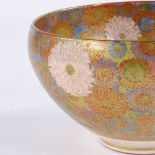 A Japanese Satsuma porcelain bowl, with painted and gilded chrysanthemum design, signed under