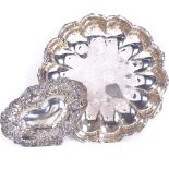 An Edwardian silver lotus-shaped dish, hallmarks Sheffield 1907, and a late Victorian silver heat-
