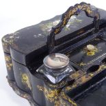 A Victorian papier mache writing box with carrying handle, allover hand painted and mother-of-