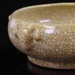 A Chinese Ge crackle glaze porcelain censer, with relief moulded ram's head design, rim diameter