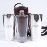 A 19th century leather-cased picnic drinks set, comprising a tapered glass flask and pair of