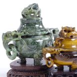 A Chinese relief carved tigers eye censer and cover, with dragon design ring handles, original