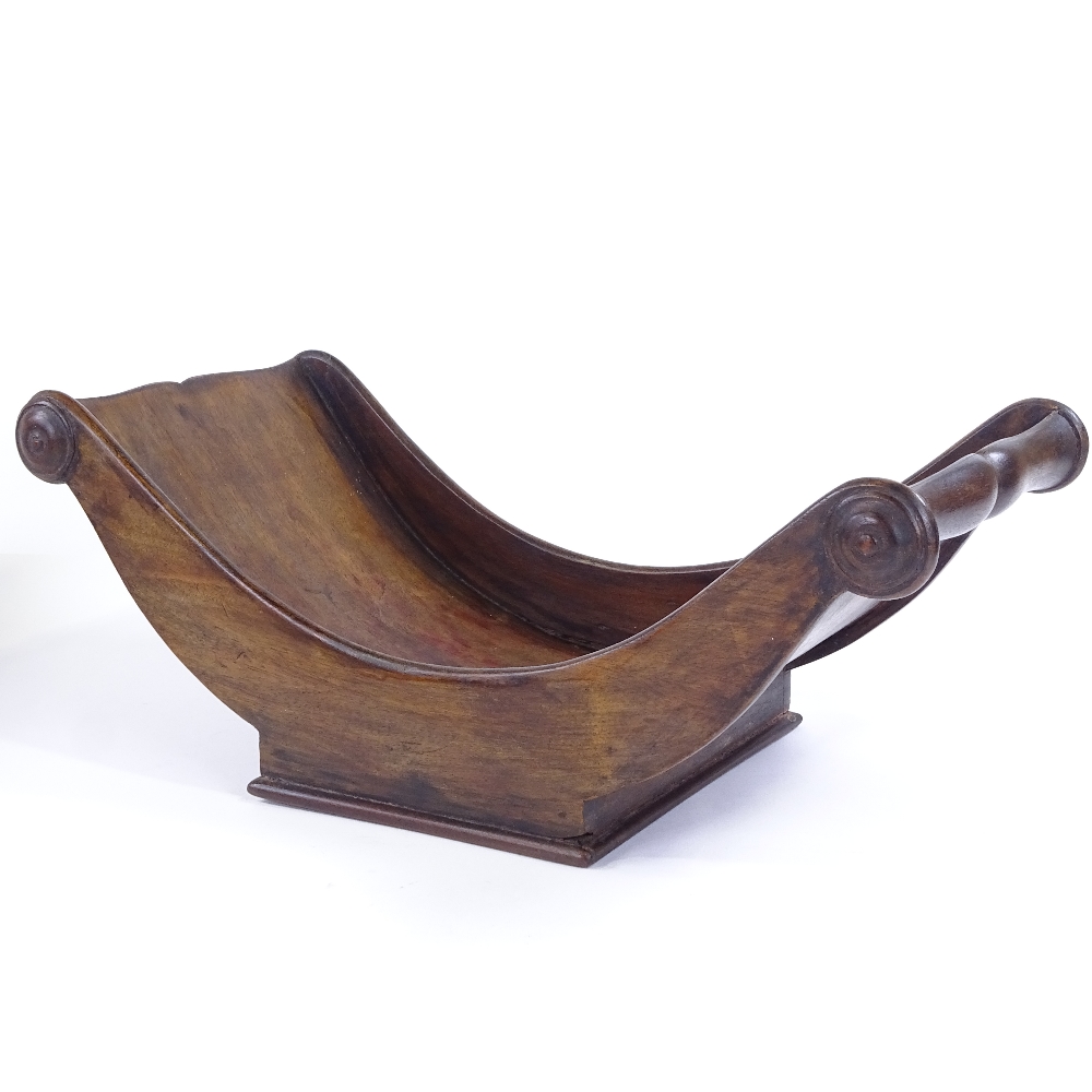 A 19th century stained wood cheese coaster, lacking original brass casters, length 41cm, width