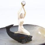 An Art Deco abalone shell dish, surmounted by a carved ivory nude woman on a bronze gurgle fish,