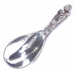 An early 20th century Danish silver presentation ladle, religious figure decorated handle with