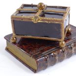 A small 19th century gilt-brass and tortoiseshell casket, length 5.5cm, and a brass simulated