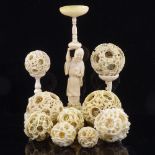 A collection of 19th century Chinese ivory puzzle balls, some on stands