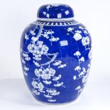 A large Chinese blue and white porcelain jar and cover, with prunus decoration, height 34cm
