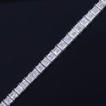 A baguette diamond tennis line bracelet, circa 1960, total diamond content approx 15ct, set with